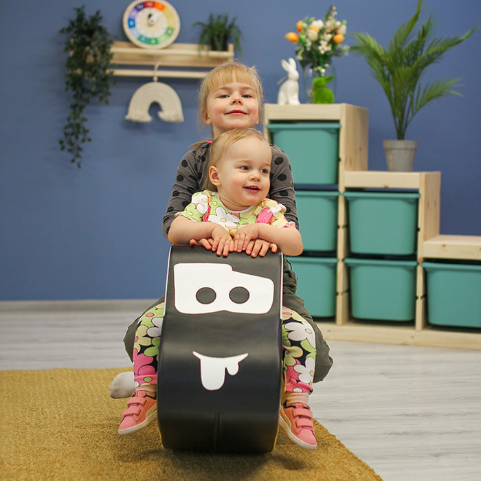 Two kids rocking on an IGLU foam rocker