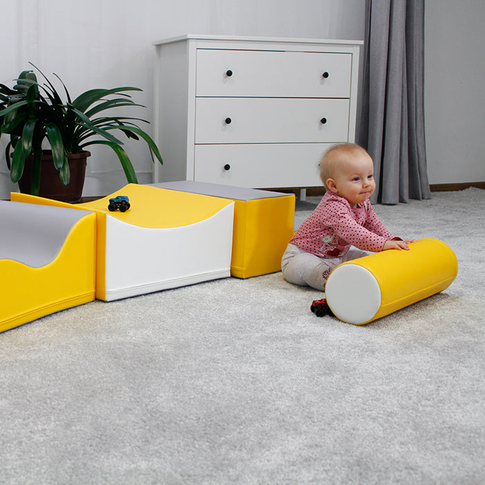 A baby is playing with an IGLU Soft Play - Advanced Wave Walk in a room, developing coordination and balance skills.