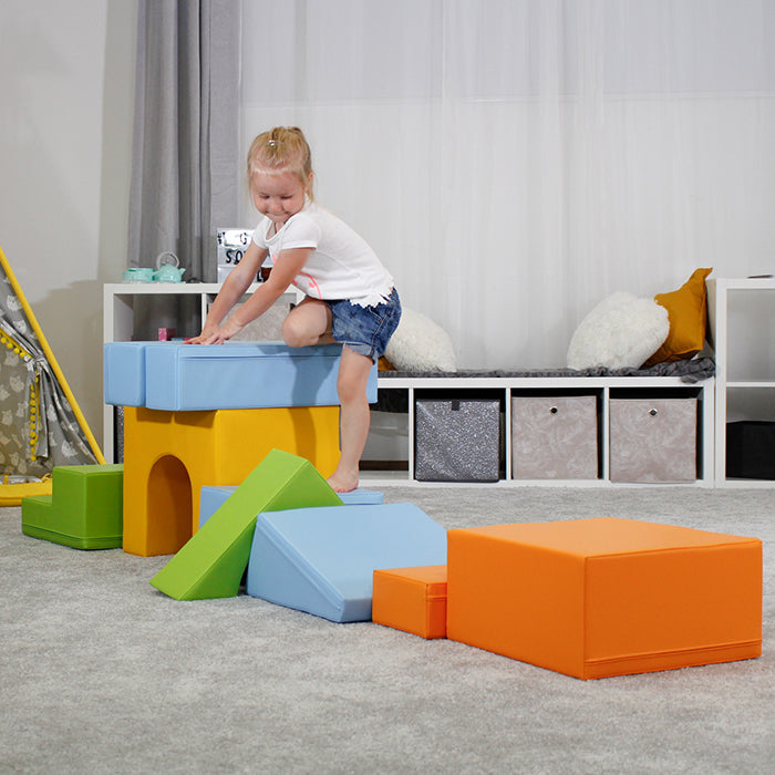 A girl climbing on an IGLU soft play set