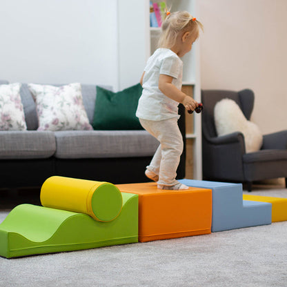 A girl walking on an IGLU soft play set