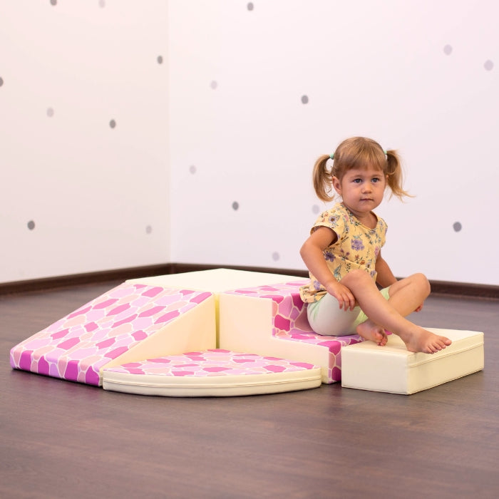 A girl playing on an IGLU soft play set