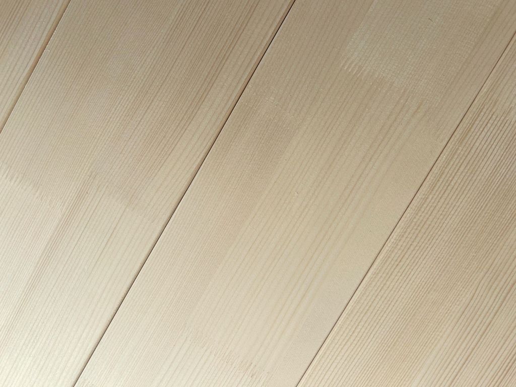 Detail van het massief houten frame van het FENCE vloerbed met bedrand