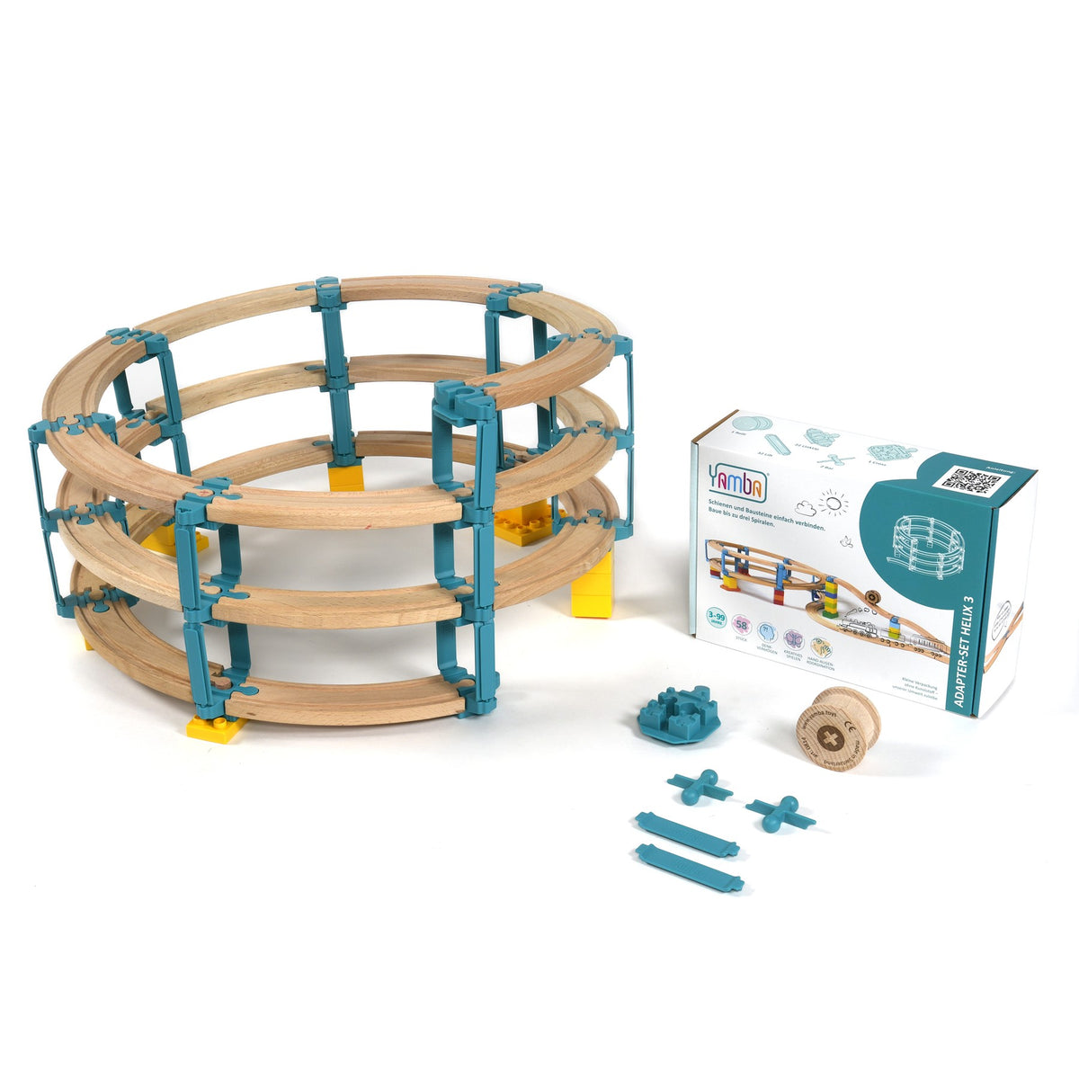 Aufgebaute Yamba Helix 3 mit Holzschienen auf drei Ebenen neben der Verpackung